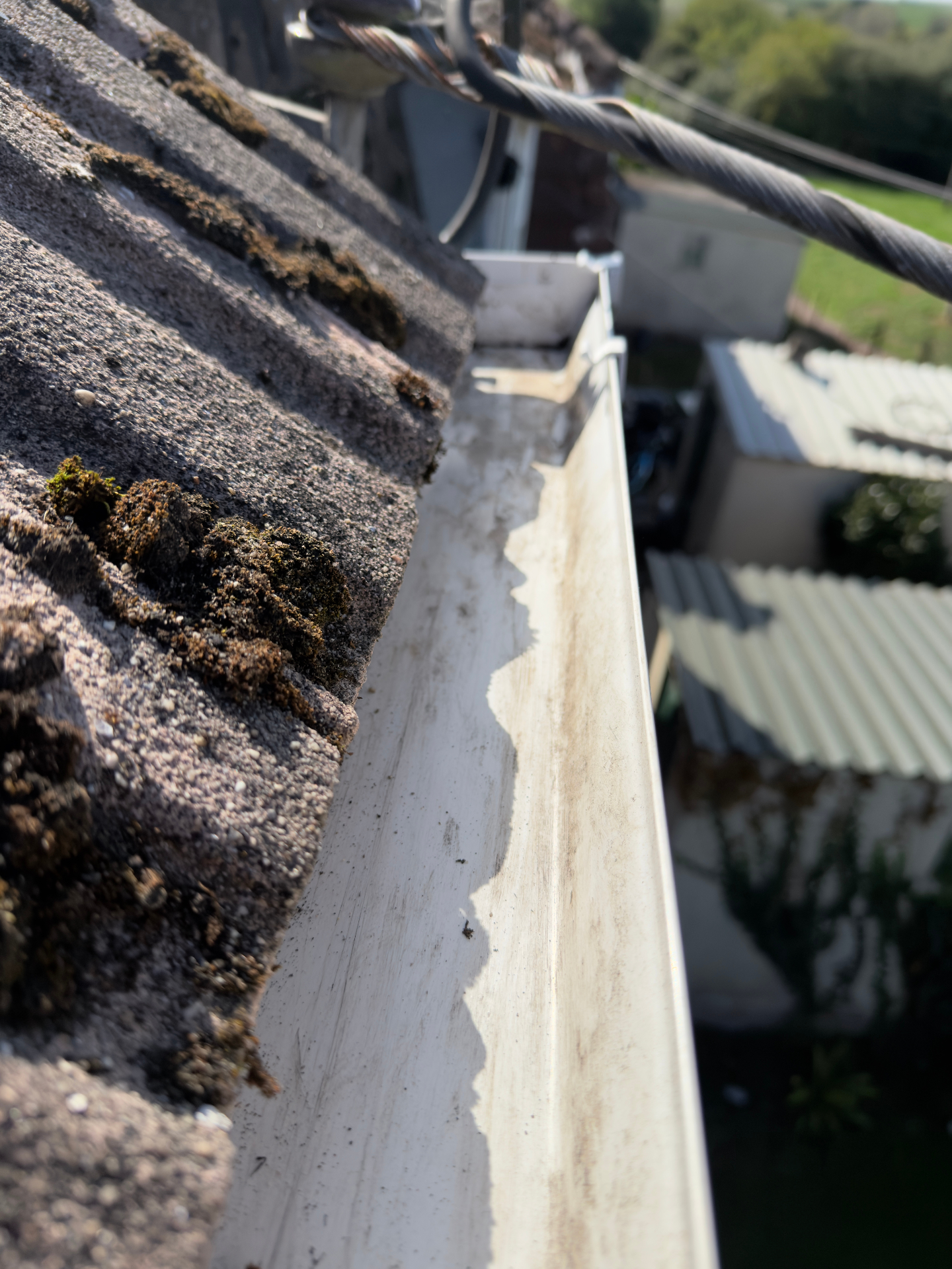 Same gutter cleared and free-flowing after OutWash cleaning