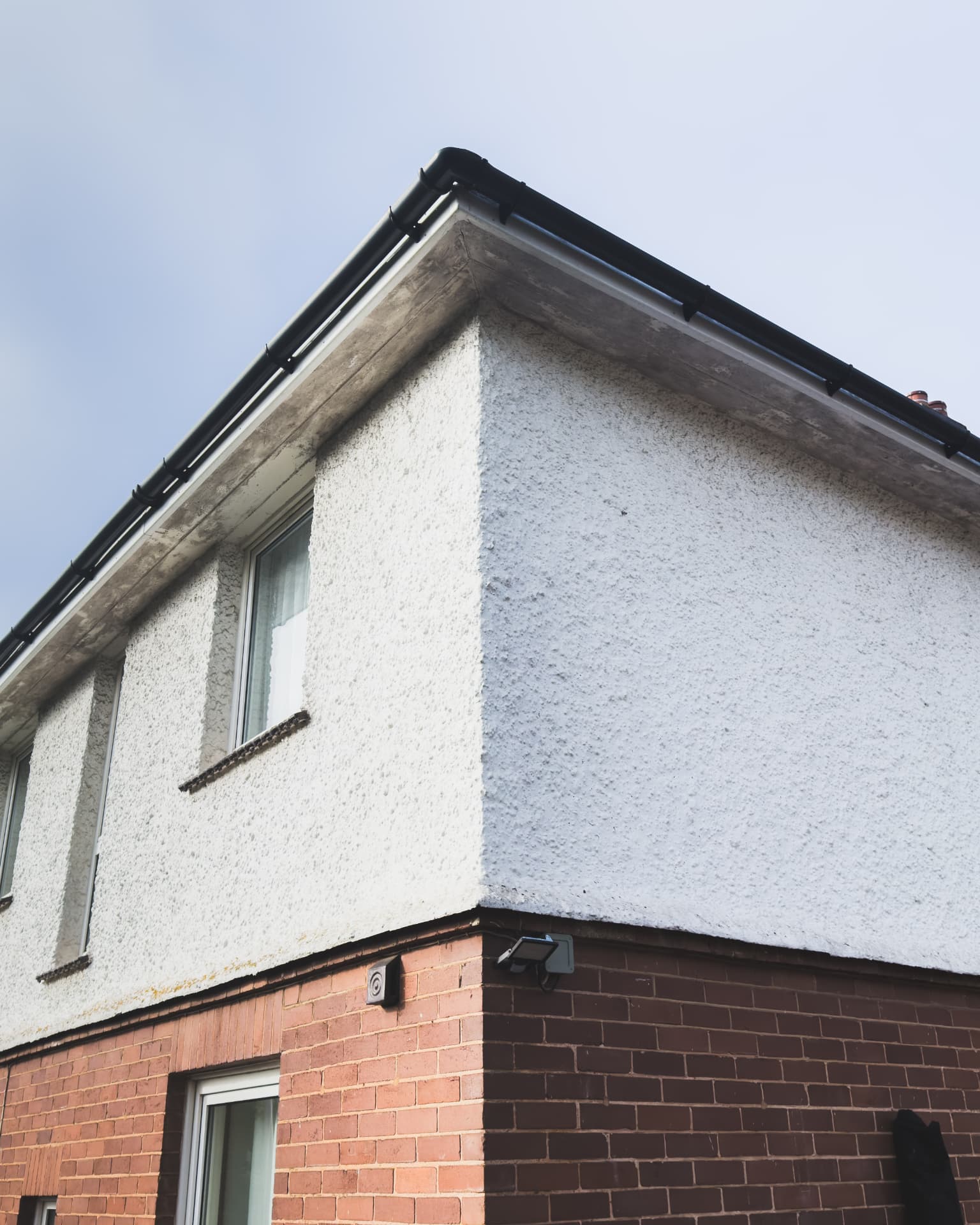 Dirty roofline with stained gutters, fascias and soffits before cleaning